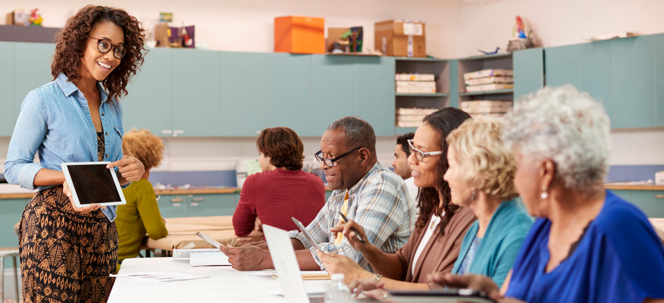 woman teaching seniors