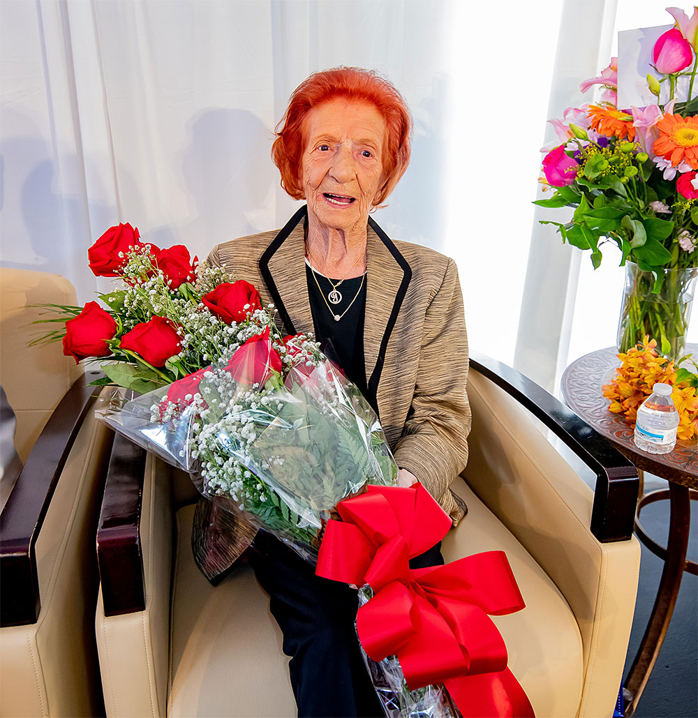 Grace Leland receives bouquet of flowers